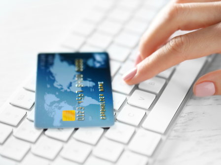 Payment card beside a keyboard